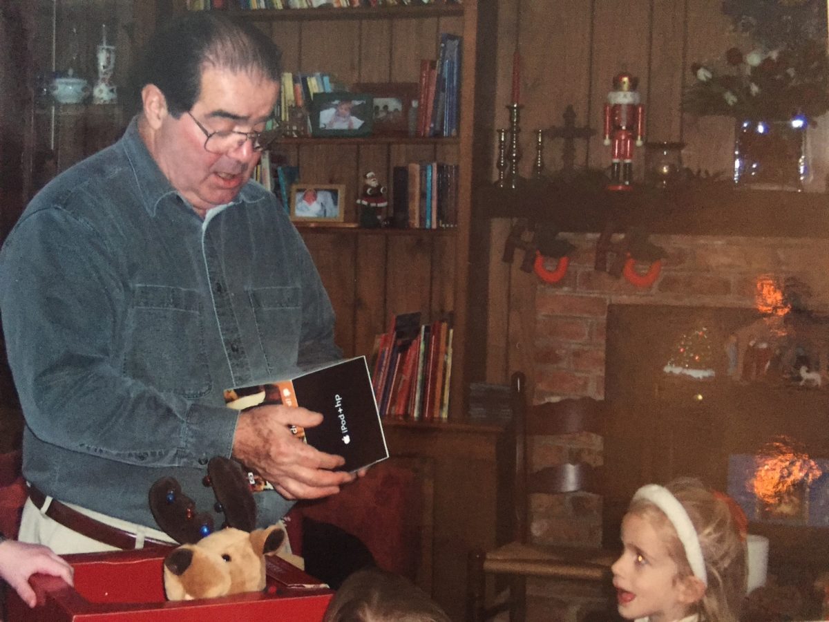 A young Bridget pictured with her grandfather, Justice Antonin Scalia, who shared a decades-long friendship with Justice Ruth Bader Ginsburg.