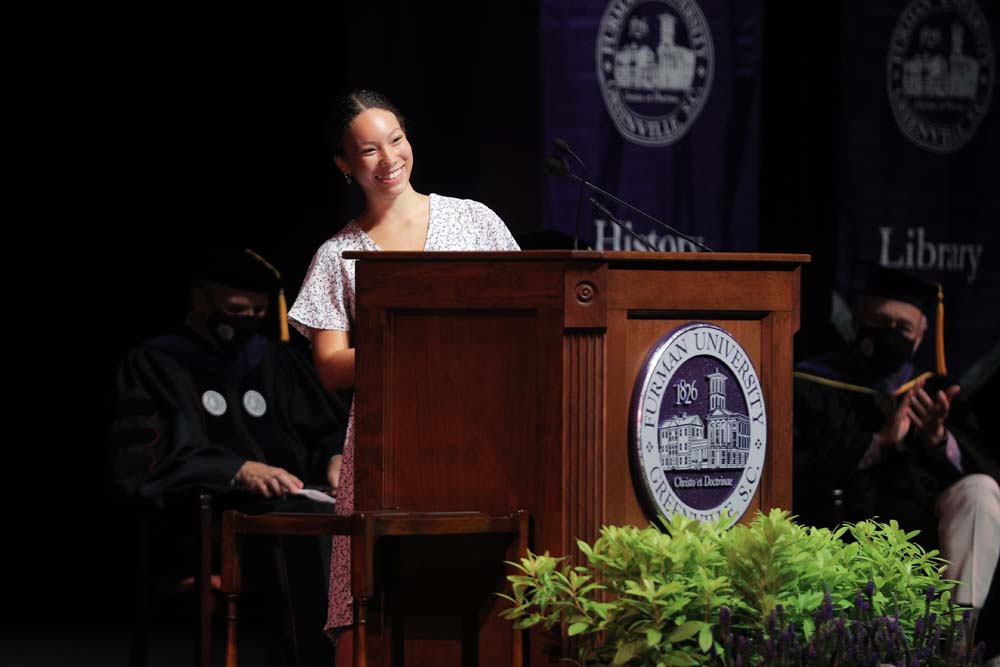 Student Body President Asha Marie '22 sharing a message of building community and impacting the trajectory of Furman during convocation.