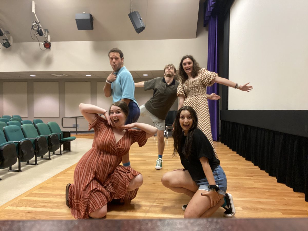 The five members of the troupe who performed Friday having fun as they prepare for the show.