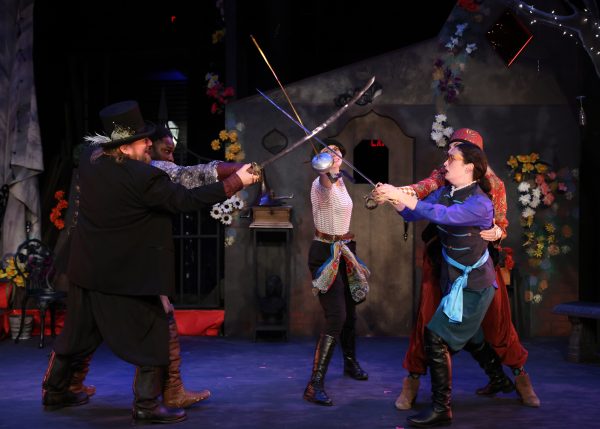 A humorous sword fight breaks out. Brock Koonce as Sir Toby (front left), Guillermo Jemmott Jr. as Sir Andrew, (back left), Christina Rose Yasi as Antonio (middle), Abby Gilbert as Fabian (back right), and Carson Hebblethwaite as Olivia disguised as Sebastian (front right).