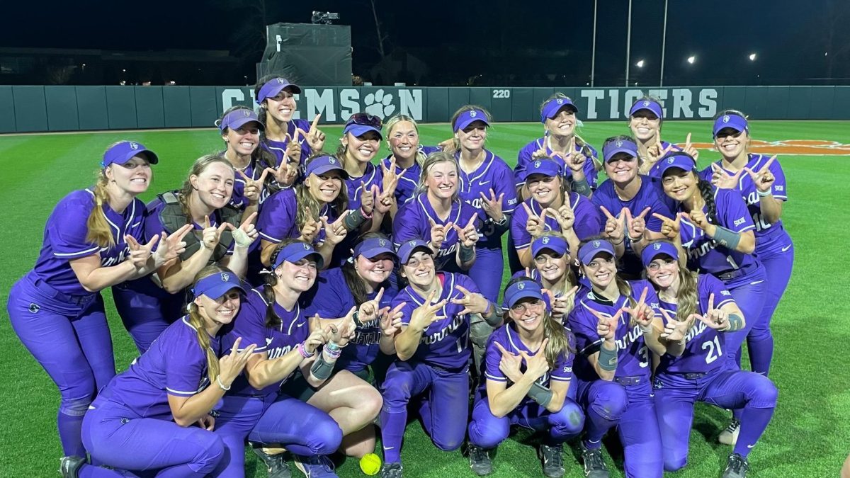 Paladin+softball+players+hold+up+the+W+after+upsetting+17th-ranked+Clemson%2C+4-3%2C+on+April+2.+