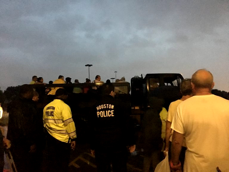 The national guard trucks picks up Wilson's family from the grocery store that they had evacuated to during Hurricane Harvey.